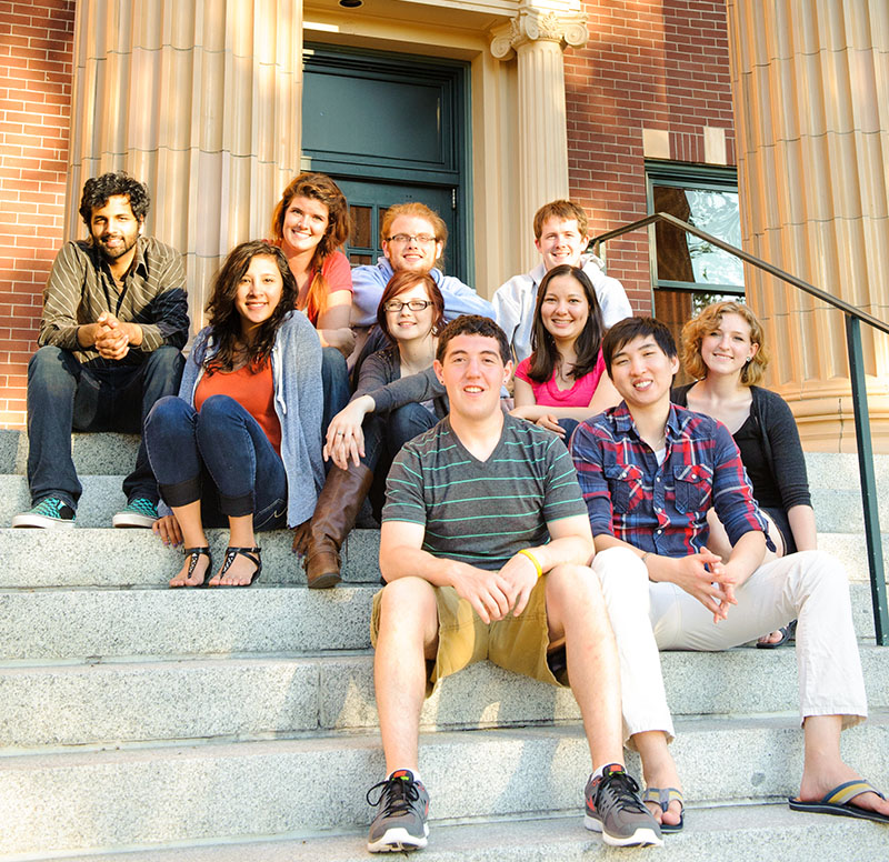 Students sitting on the steps outside Edens Hall