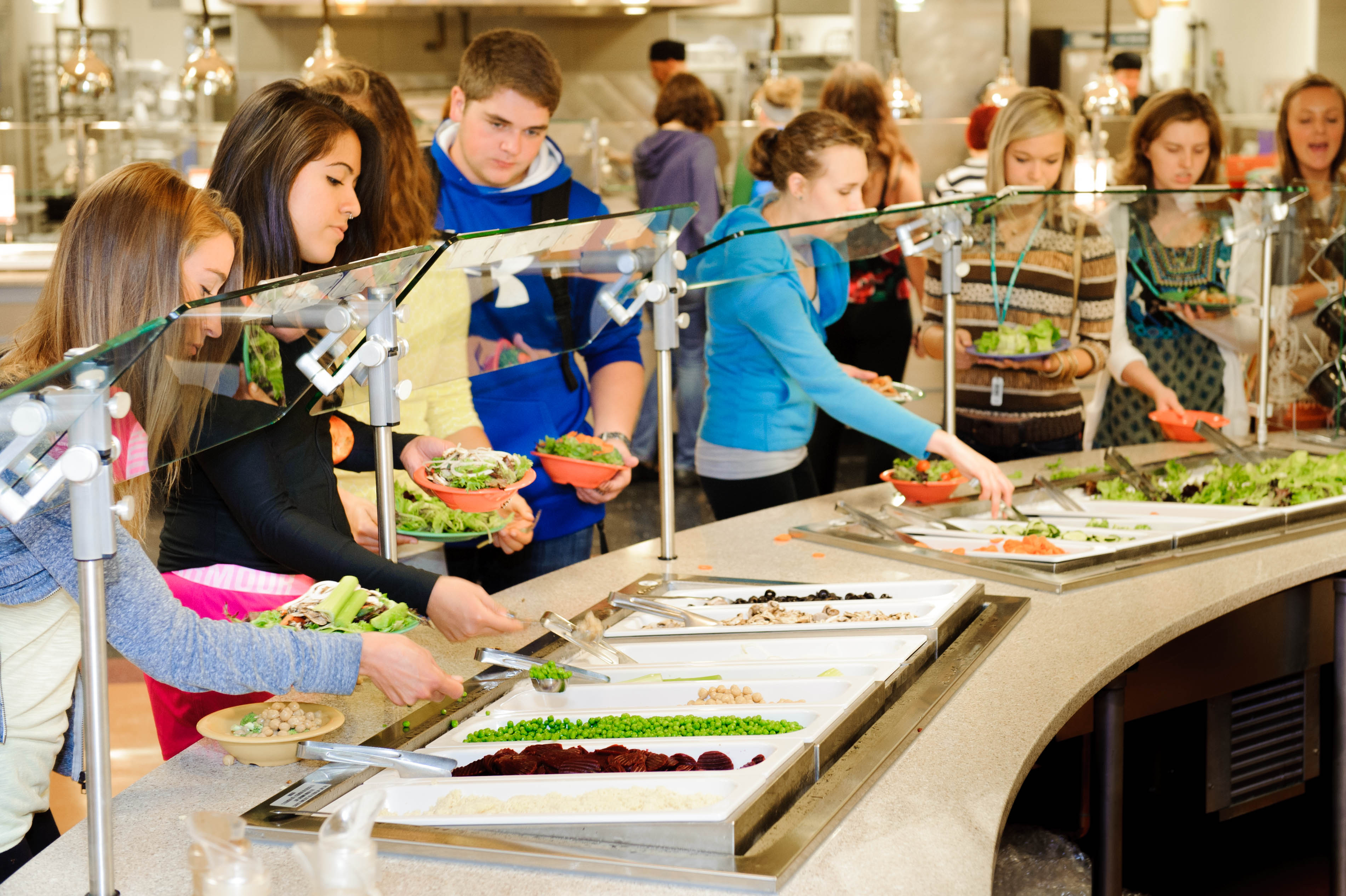 Students serve themselves food at a residential dining hall