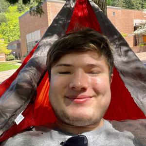 Grant smiles from a hammock 