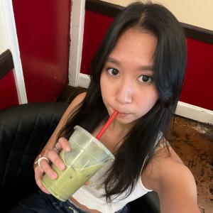 Christine sipping a matcha drink